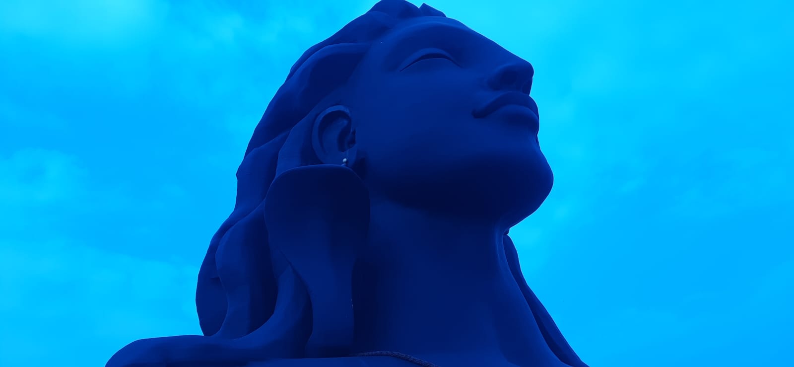 Close-up view of the Adiyogi Statue, capturing the intricate details of its meditative pose and symbolic features